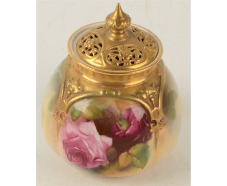 A Royal Worcester pot and cover, painted with flowers, pierced gilt cover, shape no 175, height 11.5cm. 