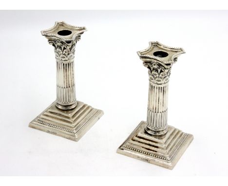 A pair of Mappin &amp; Webb silver Corinthian column candlesticks.  Condition report: 15cm (H) some denting to corners, pleas