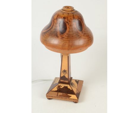 A Brazilian inlaid table lamp, with olive wood shade, height 38cm, width 20cm.