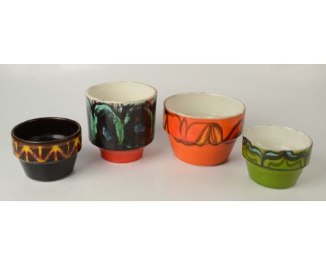 A Poole orange ground, shape 73 pot, a shape 79 Aegean pot and two shape 72 pots.