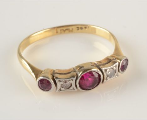An 18ct gold ring set two diamonds and three rubies. Condition report: Size L. Small chip to centre ruby.