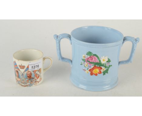 A Victorian blue pottery loving cup with two frogs inside, a farmer's arms loving cup, a blue and white print decorated early