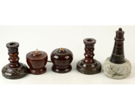 A serpentine lighthouse,19.5cm, a pair of candlesticks 12.5cm and two lamp bases.