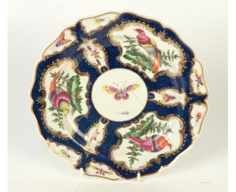 A pair of 18th century Worcester scale blue ground shaped dishes, each with three principal panels of exotic birds in landsca