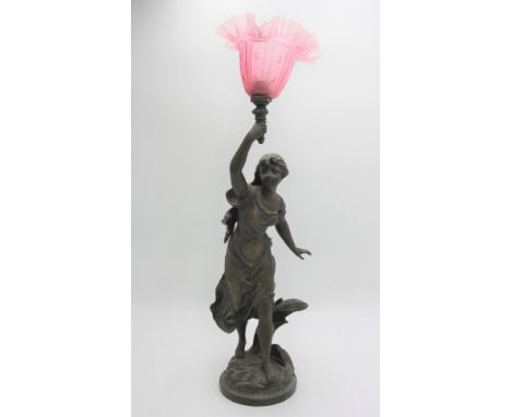A French spelter figural lamp, late 19th century, entitled 'L'Orage' with cranberry shade, height 60cm.
