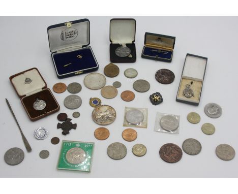 A silver Royal Lifesaving Society award of merit dated 1928, boxed, together with various coins, two large agricultural silve