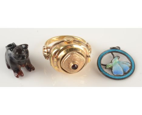 A 1950s gold plated finger ring watch, an enamelled silver butterfly pendant and a serpentine cat charm.