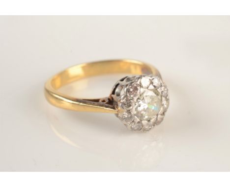 An 18ct gold ring set a diamond cluster, the central stone of approximately 0.5ct.