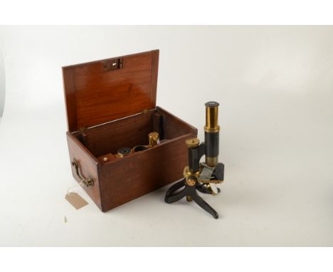 A brass and black lacquered microscope, by 'Swift &amp; Son, 81 Tottenham Ct Rd, London WC', in a mahogany fitted case with a