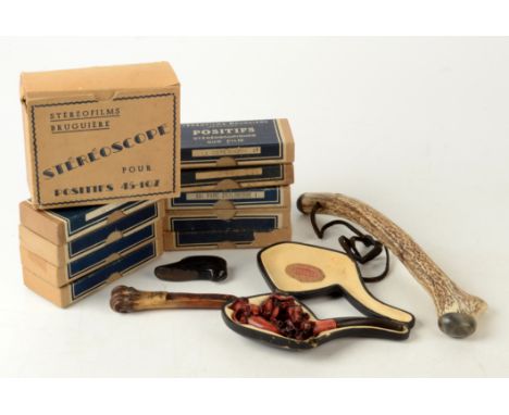 A Goudron meerschaum pipe, carved with an amorous couple, in original leather case, length 14cm, an interesting bone apple co