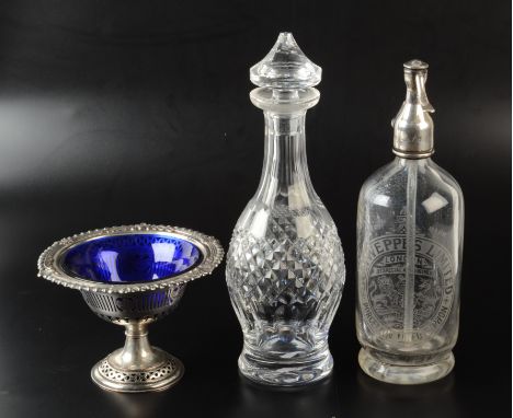 A cut glass decanter by Waterford, a silver plated bowl with blue glass liner, a Schweppes etched soda syphon and eight assor