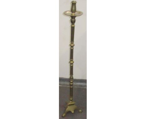 A brass altar candlestick, height 116cm. plus a painted wooden candlestick.