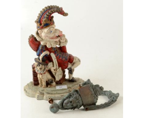 A painted cast iron doorstop depicting Punch, height 31cm, width 23cm, and a door knocker, height 20cm. 
