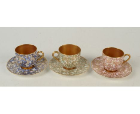 A harlequin set of three Royal Worcester porcelain cabinet cups and saucers, with gilt and foliate printed decoration. Condit