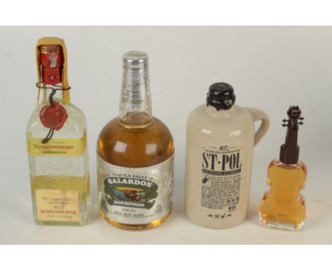 A mixture of spirits including a Suntory Royal Whisky in Violin Bottling, Galardon Gran Reposado Tequila, Schladerer Kirschwa
