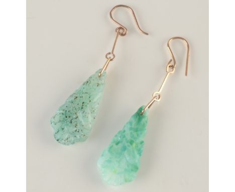 A pair of earrings in glass simulating jade.