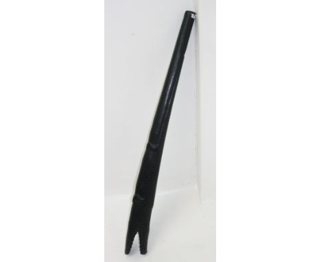 A New Guinea didgeridoo, carved with a crocodile, length 132cm. Found in the Sepik River region in the 1960s. 