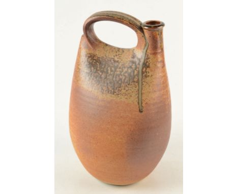 A John Leach studio pottery stirrup form bottle vase, height 34cm, impressed marks, exhibition label No. 9. 