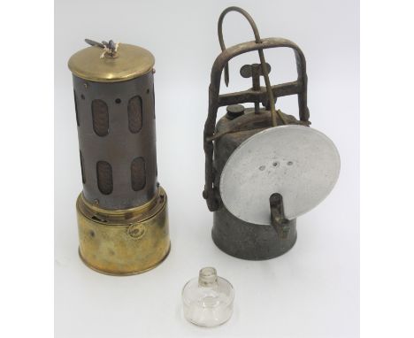 A miner's carbide lamp, model name 'Crestella' makers mark to the back 'Premier Lamp Engineering Co Ltd of Leeds, height 23.5