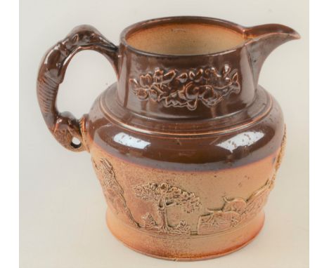 A George III salt glazed stoneware jug, with sprigged on decoration of hunting scenes, greyhound handle, maximum height 19.5 