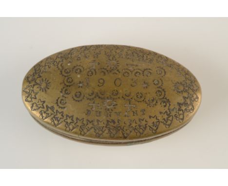 A brass oval pocket snuff box crudely inscribed John Williams, 1903, Dunvant. 