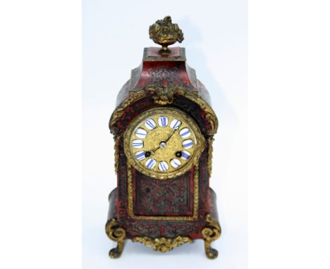 A French boulle mantle clock, 19th century, the 8cm gilt metal dial with Roman numerals on ball and claw feet, height 31.5cm,