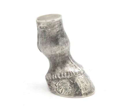 A Victorian silver novelty vesta case in the form of a horse's lower leg, the hoof is ornately engraved and inscribed 'First 