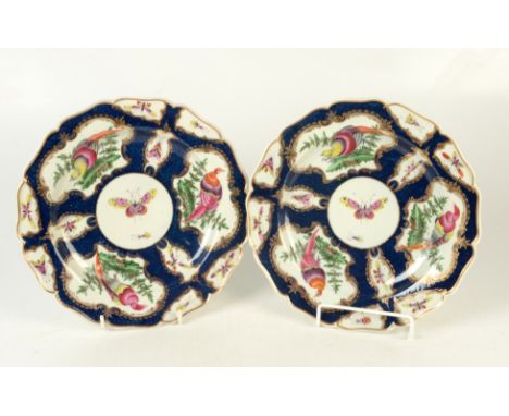 A pair of 18th century Worcester scale blue ground shaped dishes, each with three principal panels of exotic birds in landsca