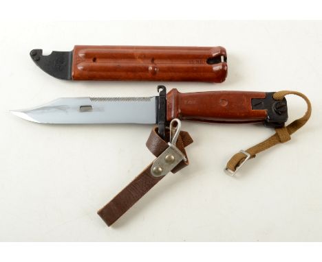 A bayonet, in a brown bakelite scabbard, length 27.5cm.