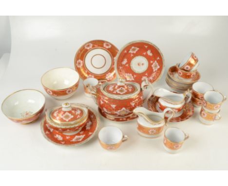 A Regency Spode and Chamberlains Worcester service in iron red and gold with tendrils, flower heads, and buds on iron red gro