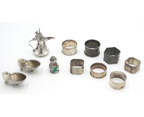 A pair of silver shell salts, a miniature silver Arabic coffee pot, six various silver napkin rings, and a Meka Denmark Sterl