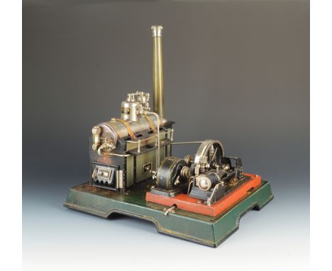 A Marklin for Gamages tinplate static steam engine generator with single horizontal cylinder, made in Germany for A.W. Gamage