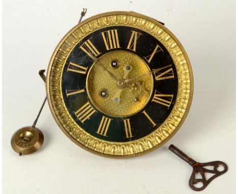 A Victorian eight day mantel clock movement, pendulum and winder.