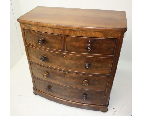 A Victorian mahogany bow front chest of drawers, with two short and three long drawers on bun feet, height 114cm, width 104cm