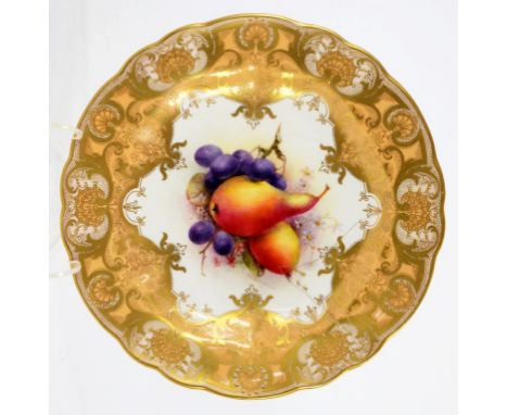 A ROYAL WORCESTER PLATE PAINTED BY R SEBRIGHT, SIGNED, WITH FRUIT IN RICHLY GILT APRICOT BORDER AND LOBED RIM, 22.5CM DIAM, P