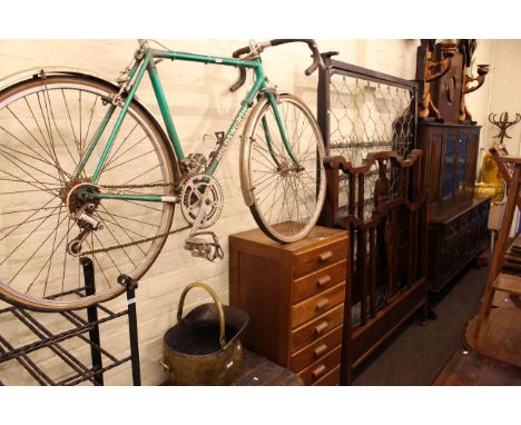 Edwardian mahogany double bedstead, eight drawer oak chest, Holdsworth racing cycle, brass coal helmet, tin trunk and wrought