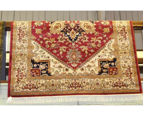 Heriz carpet with a red ground, 2.30m x 1.60m