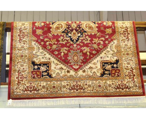 Heriz carpet with a red ground, 2.30m x 1.60m