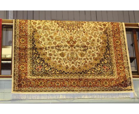 Keshan carpet with a beige ground. 2.30m x 1.60m