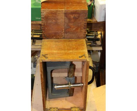 Two scientific instruments in wooden boxes