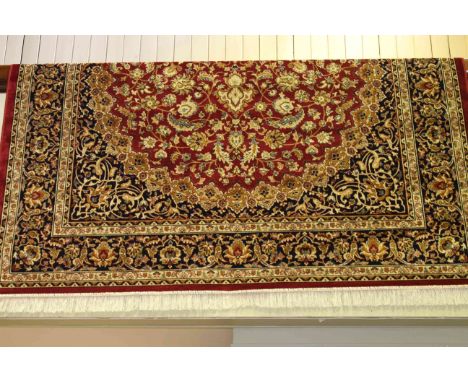 Keshan carpet with a red ground, 2.80m x 2.00m