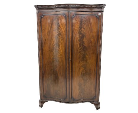 Early 20th century mahogany serpentine double wardrobe, inside fitted with rail and top shelfDimensions: Height:&nbsp;195cm&n