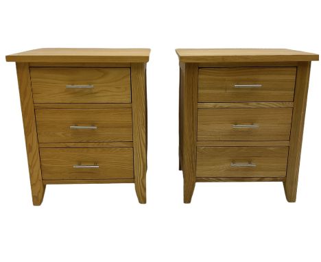 Pair of light oak three drawer bedside chestsDimensions: Height:&nbsp;61cm&nbsp; Length/Width:&nbsp;51cm&nbsp; Depth/Diameter