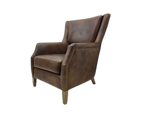 Library chair, upholstered in tan leather, studded detail, light wood square feetDimensions: Height: 98cm  Length/Width: 75cm