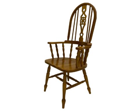 Hardwood Windsor armchair, hoop and stick back with pierced wheel splat, on turned supports with double H stretcher Dimension