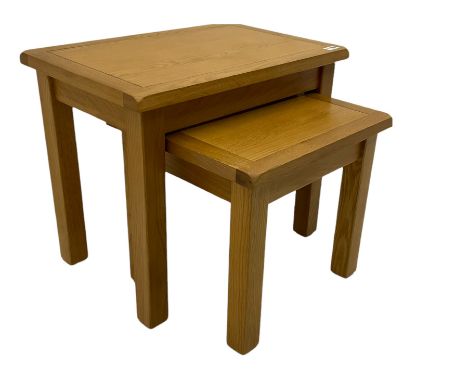 Light oak nest of two tablesDimensions: Height:&nbsp;51cm&nbsp; Length/Width:&nbsp;60cm&nbsp; Depth/Diameter:&nbsp;40cm