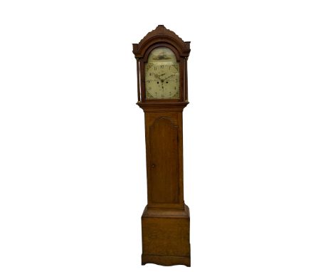 A provincial oak longcase clock retailed by “Geo Hunt, Amesbury” c1820, with a crested break arch pediment and corresponding 