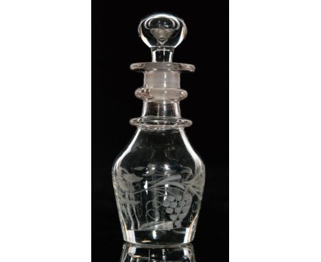 A late 18th Century miniature decanter circa 1800, of Prussian form engraved with a running fruiting vine design below two ri