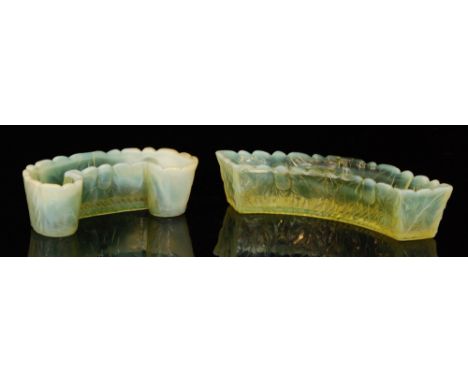 A late 19th Century Burtles & Tate pressed glass trough of crescent form in a graduated citron to opalescent with relief moul