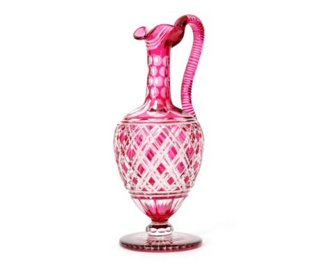 A late 19th Century Stourbridge claret jug possibly by Richardson, of footed form to a faceted knop below the ovoid body risi